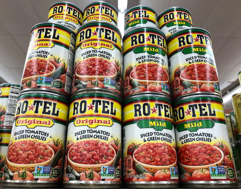 cans of rotel tomatoes on a grocery store shelf